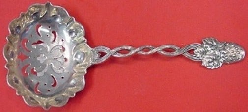 Tiffany & Co Strawberry Vine Sterling Silver Sugar Sifter 5.5": Tiffany & Co Strawberry Vine Sterling Silver Sugar Sifter 5.5" Introducing the exquisite Strawberry Vine Sugar Sifter by Tiffany & Co., a remarkable serving piece crafted in sterling silver. This eleg