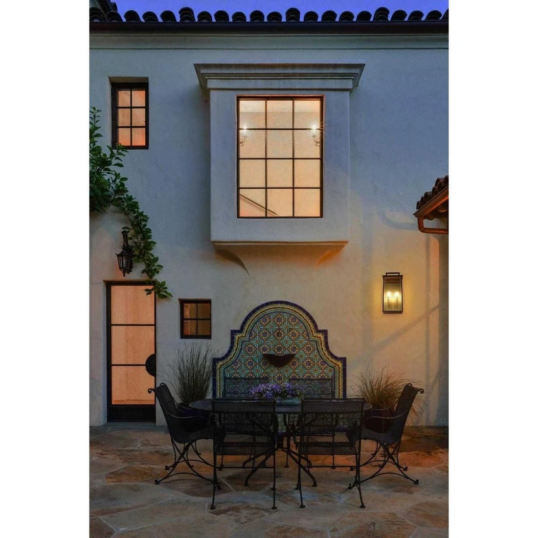 Kannon black ribbed glass outdoor wall light 2 bulbs: Kannon black ribbed glass outdoor wall light 2 bulbs This outdoor wall sconce features a traditional design with a black iron frame and ribbed glass panels, providing both durability and classic style