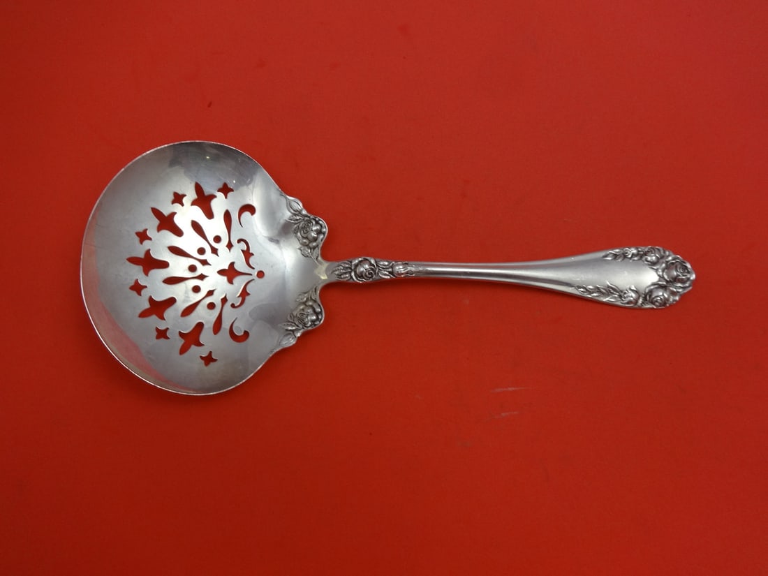 Wallace Rose Sterling Silver Serving Spoon 8 1/4": Wallace Rose Sterling Silver Serving Spoon 8 1/4" Discover the elegance of the Rose pattern by Wallace with this stunning sterling silver pea spoon, measuring 8 1/4 inches. Crafted with precision, thi