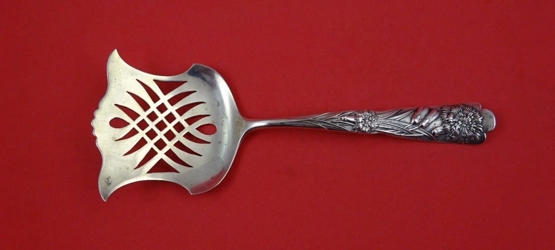 Sterling Silver Cucumber Server Flora Pattern with Carnation 7 1/4 Inch: Sterling Silver Cucumber Server Flora Pattern with Carnation 7 1/4 Inch This is a sterling silver cucumber server featuring a carnation motif in the Flora pattern by Shiebler. Made in the United State
