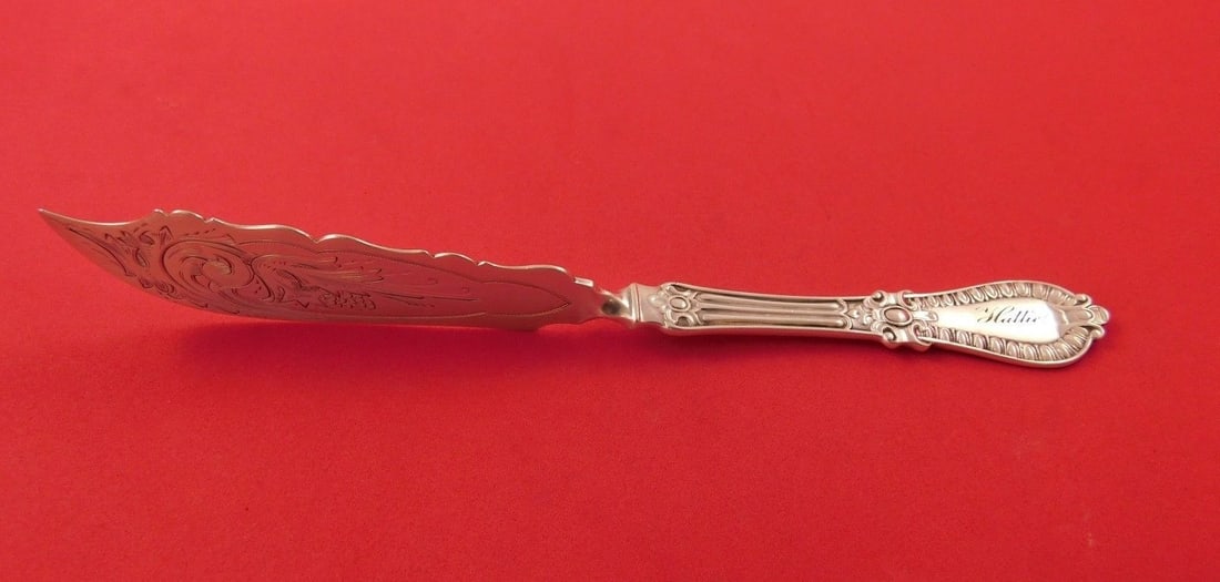 Wood & Hughes Gadroon Master Butter Knife Sterling Silver 8 in: Wood & Hughes Gadroon Master Butter Knife Sterling Silver 8 in Sterling silver master butter in the Gadroon pattern by Wood & Hughes. It features a flat twist handle, bright-cut detailing, and a monog