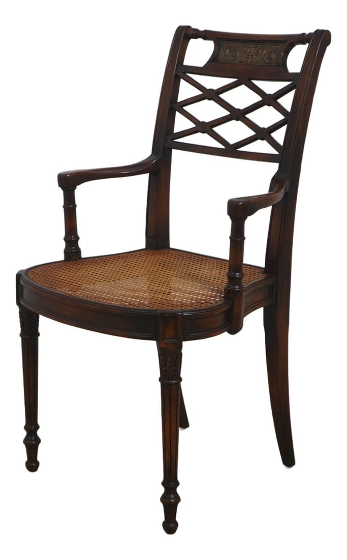 Regency Style Mahogany Armchair with Cane Seat 22w x 23d x 40h: Regency Style Mahogany Armchair with Cane Seat 22w x 23d x 40h Regency style cane seat arm chair in mahogany with an inset bronze plaque, fine carved details, and inlay work throughout. The chair is d