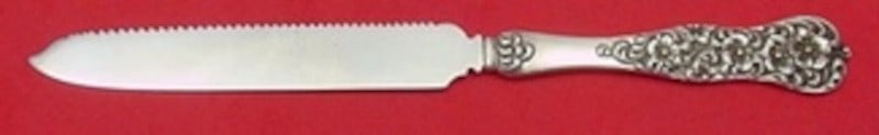 Dominick Haff Rococo Sterling Citrus Knife Serrated 8: Dominick Haff Rococo Sterling Citrus Knife Serrated 8 This is a Dominick & Haff sterling silver citrus knife in the Rococo pattern, featuring a flat handle and an 8-inch serrated blade. Made in the Un