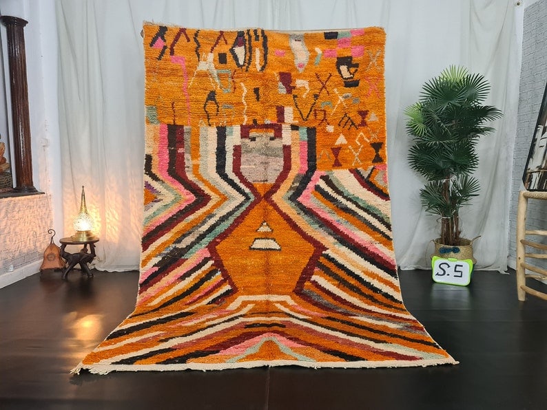 Authentic Handmade Moroccan Berber Wool Rug 10 x 5 Feet: Authentic Handmade Moroccan Berber Wool Rug 10 x 5 Feet Discover the beauty of the Authentic Orange Handmade Moroccan Berber Wool Rug, meticulously handwoven by local Berber women in the Middle Atlas 