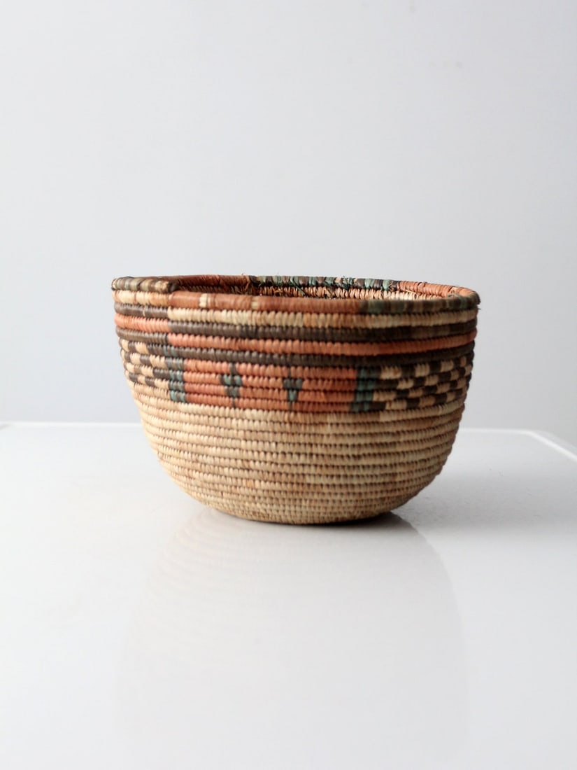 Vintage Tribal Woven Basket 10.5 Inch Decorative Bowl: Vintage Tribal Woven Basket 10.5 Inch Decorative Bowl This vintage tribal basket showcases exquisite craftsmanship with a beautifully woven design. The bowl features a striking decorative pattern in l