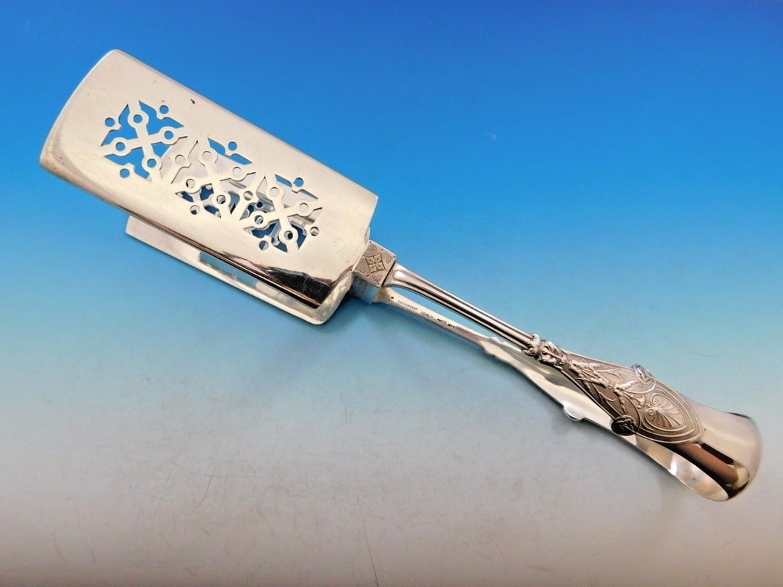 Tiffany & Co. Italian Sterling Silver Yoked Asparagus Tongs 10.5": Tiffany & Co. Italian Sterling Silver Yoked Asparagus Tongs 10.5" Elevate your dining experience with these exquisite Sterling Silver Asparagus Tongs from Tiffany & Co. Crafted in the elegant Italian 