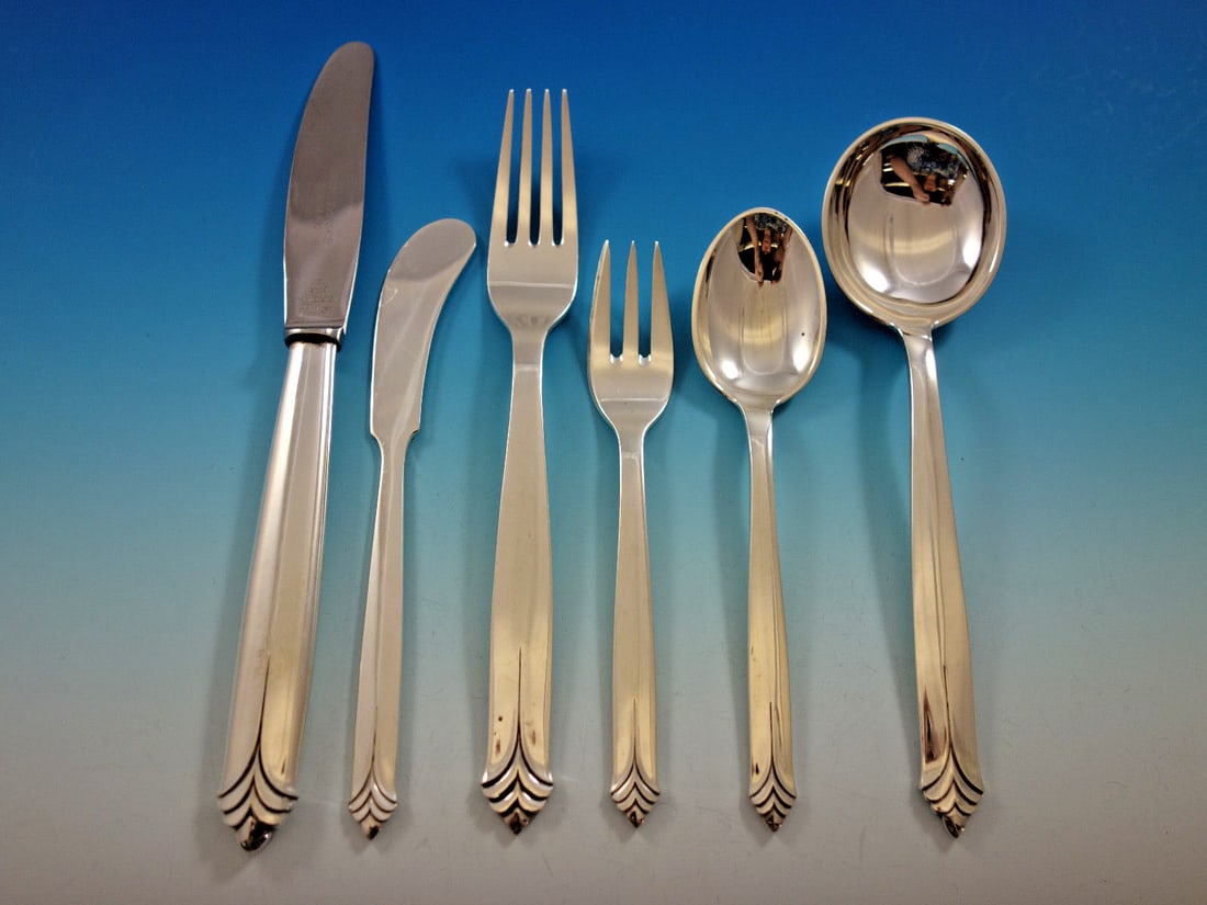 Evald Nielsen Tropic Sterling Silver 48 Piece Art Deco Flatware Set: Evald Nielsen Tropic Sterling Silver 48 Piece Art Deco Flatware Set This rare Tropic pattern flatware set by Evald Nielsen is crafted in sterling silver and reflects Danish Art Deco design. The set co