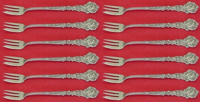 Gorham Versailles Sterling Silver Cocktail Fork Set 12 Pieces: Gorham Versailles Sterling Silver Cocktail Fork Set 12 Pieces This exquisite set features 12 cocktail forks crafted in sterling silver, showcasing the elegant Versailles pattern by Gorham. Each fork m