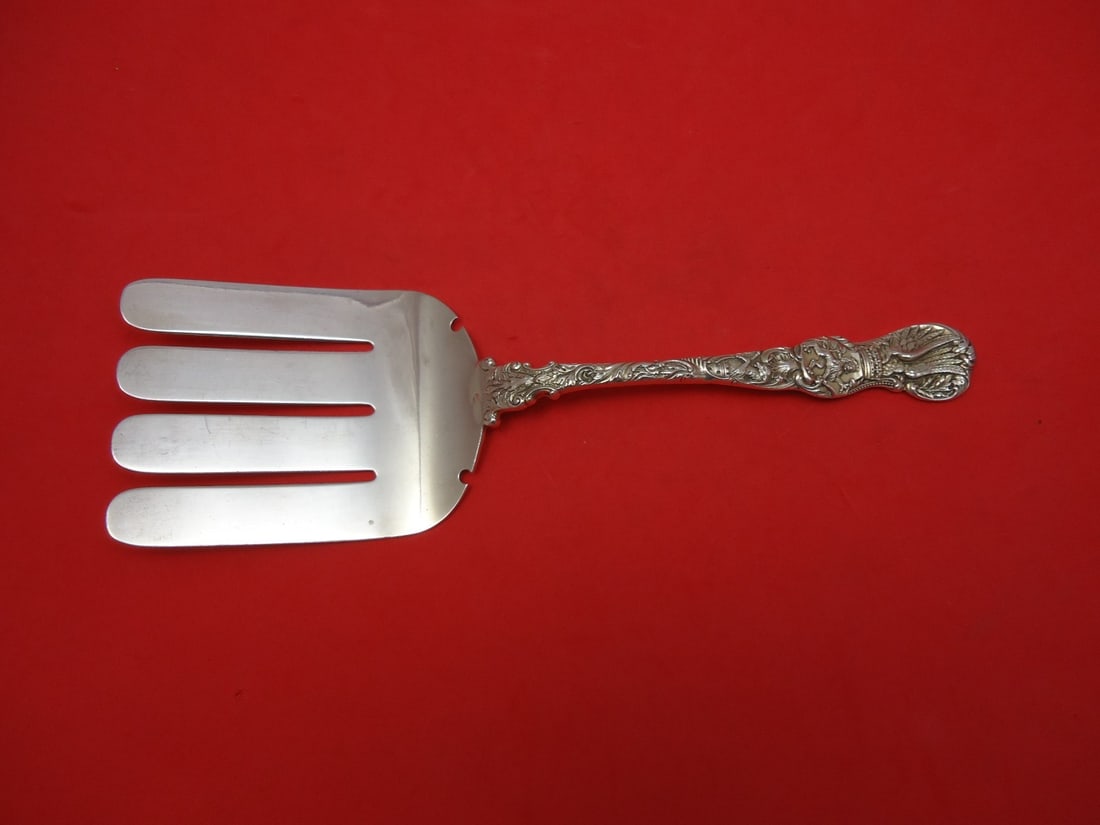 Durgin Heraldic Sterling Silver Serving Asparagus Fork 9 1/2 in: Durgin Heraldic Sterling Silver Serving Asparagus Fork 9 1/2 in Sterling silver asparagus serving fork in the Heraldic pattern by Durgin. The pattern was introduced in 1888 and features a decorative h