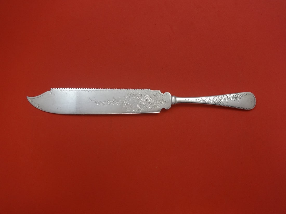 Gorham Marguerite Engraved Sterling Silver Cake Knife 10 1/4 Serrated: Gorham Marguerite Engraved Sterling Silver Cake Knife 10 1/4 Serrated This exquisite cake knife is crafted in sterling silver and features the elegant Marguerite Engraved pattern by Gorham. The knife 