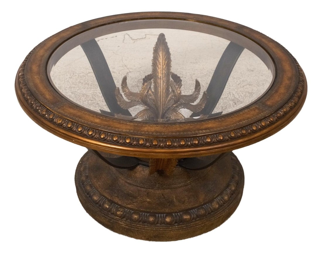 Ornate Round Coffee Table with Glass Top and Iron Base: Ornate Round Coffee Table with Glass Top and Iron Base This exquisite round coffee table features a stunning beveled glass insert set within a beautifully tooled leather outer edge. The ornate base sh