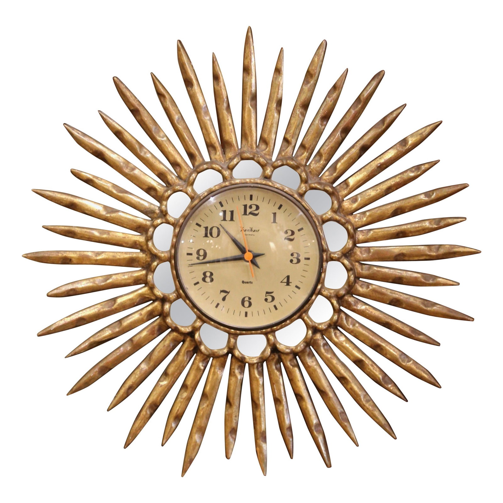 Spanish Giltwood Sunburst Wall Clock with Hand-Carved Mirrored Accents Circa 1970: Spanish Giltwood Sunburst Wall Clock with Hand-Carved Mirrored Accents Circa 1970 This mid-century Spanish sunburst wall clock features a hand-carved giltwood frame with mirrored insets and a central 