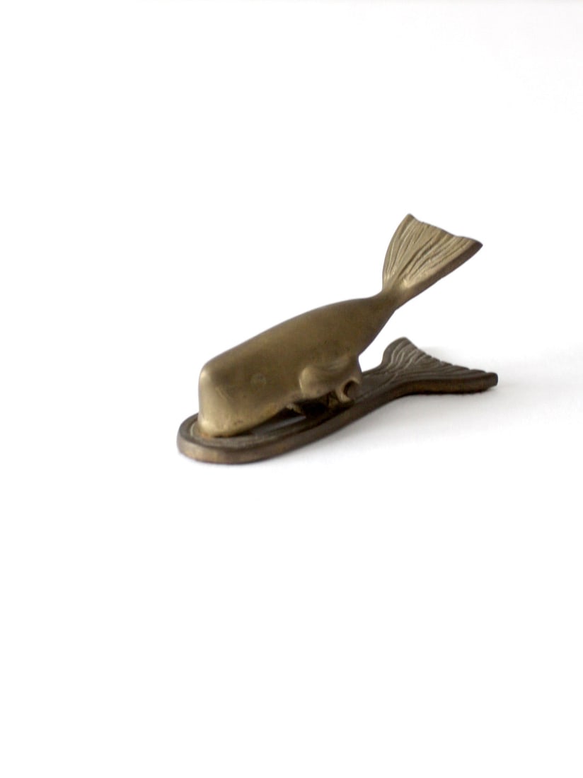 Mid-Century Vintage Brass Whale Paper Clip Decorative Desk Accessory: Mid-Century Vintage Brass Whale Paper Clip Decorative Desk Accessory Add a touch of charm to your workspace with this vintage brass whale-shaped paper clip. This mid-century piece combines decorative 