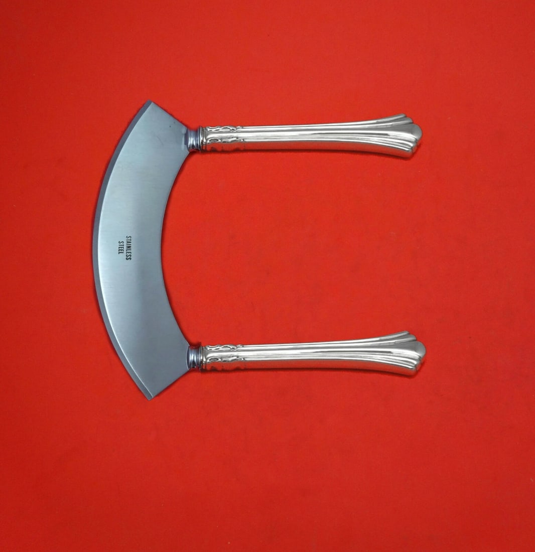 Reed & Barton Eighteenth Century Sterling Silver Mezzaluna Knife Custom: Reed & Barton Eighteenth Century Sterling Silver Mezzaluna Knife Custom Elevate your culinary experience with this exquisite Eighteenth Century Mezzaluna Knife, custom crafted by Reed & Barton. Featur