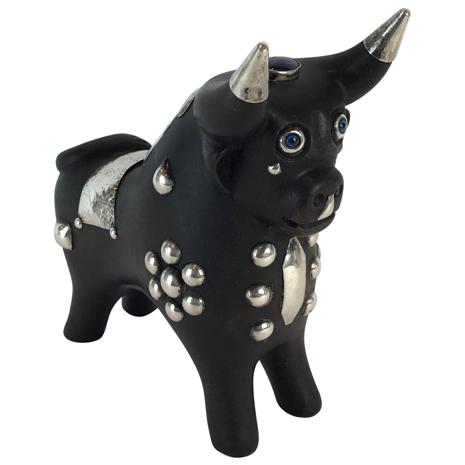 Mid-Century Modern Wood and Sterling Silver Taurus Bull Sculpture: Mid-Century Modern Wood and Sterling Silver Taurus Bull Sculpture This exquisite midcentury sculpture features a beautifully carved wood and sterling silver Taurus bull, showcasing an expressive face 