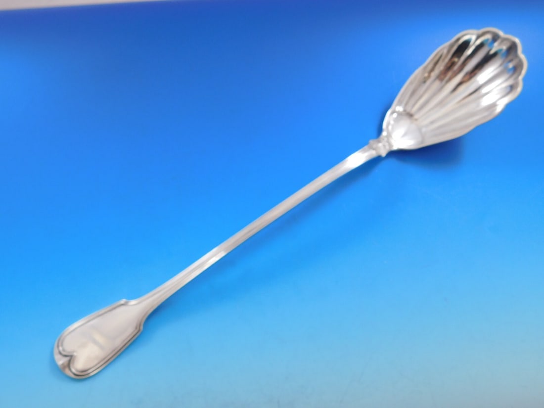 Kirk Fiddle Thread Sterling Silver Serving Spoon 12 1/4": Kirk Fiddle Thread Sterling Silver Serving Spoon 12 1/4" This exquisite Sterling Silver Stuffing Spoon is crafted in the classic Fiddle Thread pattern by Kirk, showcasing a beautiful shell bowl. With 