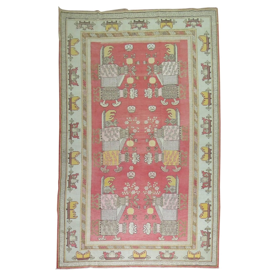 Antique Khotan Flower Vase Rug 8'8'' x 16'2'' Wool Anglo-Japanese: Antique Khotan Flower Vase Rug 8'8'' x 16'2'' Wool Anglo-Japanese This exquisite large Khotan rug showcases a stunning flower vase design against a soft pinky red background. Measuring 8'8" x 16'2" (1