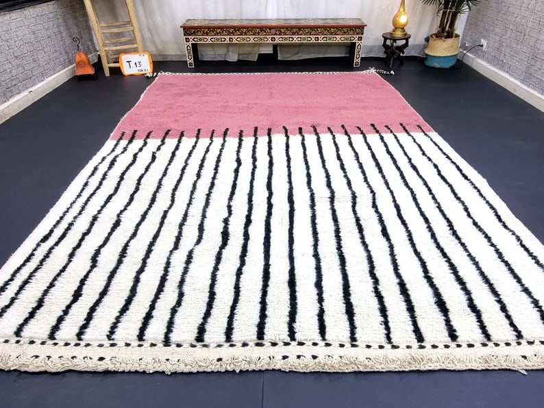 Authentic Handmade Wool Rug 9 x 5 Feet from Morocco: Authentic Handmade Wool Rug 9 x 5 Feet from Morocco This stunning handmade wool rug is a unique piece crafted by skilled Berber women weavers in the Atlas Mountains of Morocco. Utilizing traditional t
