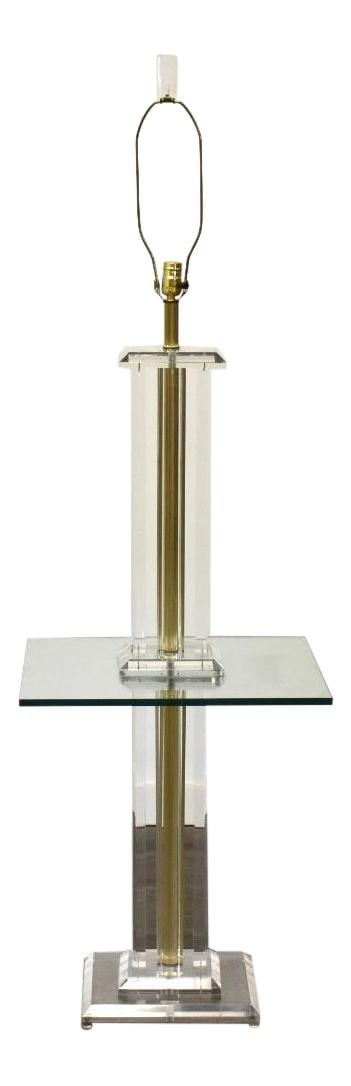Post-Modern Brass Lucite Glass Floor Lamp with Shelf 64in: Post-Modern Brass Lucite Glass Floor Lamp with Shelf 64in This striking post-modern floor lamp features a harmonious blend of lucite, brass, and glass, adding a touch of elegance to any room. It is de