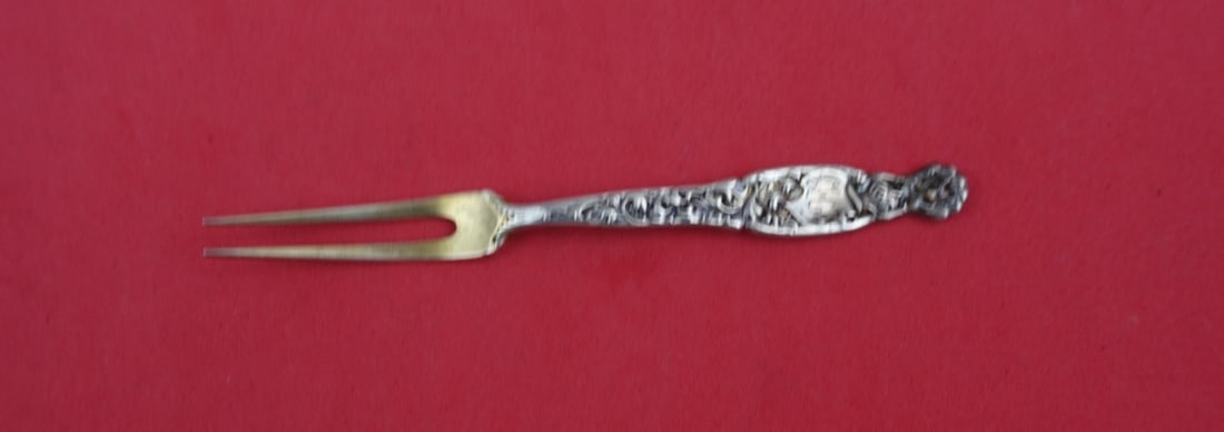 Whiting Heraldic Sterling Silver 2-Tine Strawberry Fork Gold Washed 4.25": Whiting Heraldic Sterling Silver 2-Tine Strawberry Fork Gold Washed 4.25" This exquisite serving fork features the classic "Heraldic" pattern by Whiting, crafted from high-quality sterling silver. It 