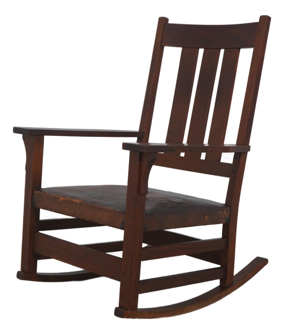 Mission Oak Rocker with Leather Seat Early 20th Century Arts and Crafts Style: Mission Oak Rocker with Leather Seat Early 20th Century Arts and Crafts Style This antique Mission style rocking chair, dating from circa 1900-1910, features high-quality construction in oak with vert