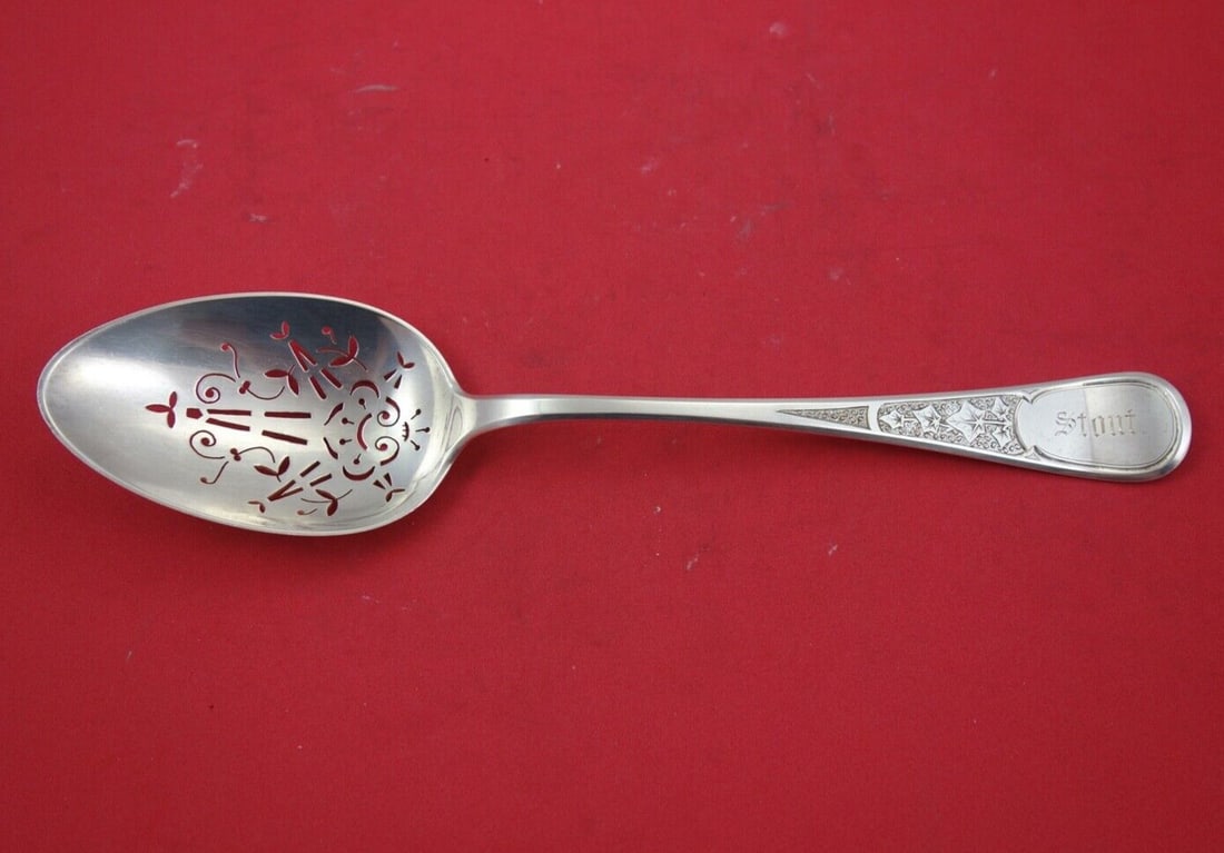 Tiffany & Co Ivy Antique Engraved Sterling Silver Ice Spoon 10 1/4": Tiffany & Co Ivy Antique Engraved Sterling Silver Ice Spoon 10 1/4" This exquisite serving spoon, known as the Ivy or Antique Ivy Engraved pattern, is crafted from sterling silver by Tiffany & Co. The