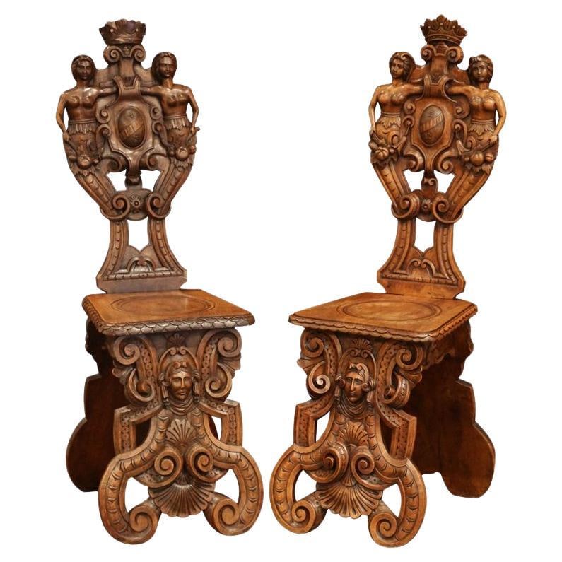 19th Century Italian Renaissance Walnut Sgabello Chairs Set of 2: 19th Century Italian Renaissance Walnut Sgabello Chairs Set of 2 Enhance your entryway or hallway with this exquisite pair of 19th Century Italian Renaissance Walnut Sgabello Chairs. Hand-crafted in I