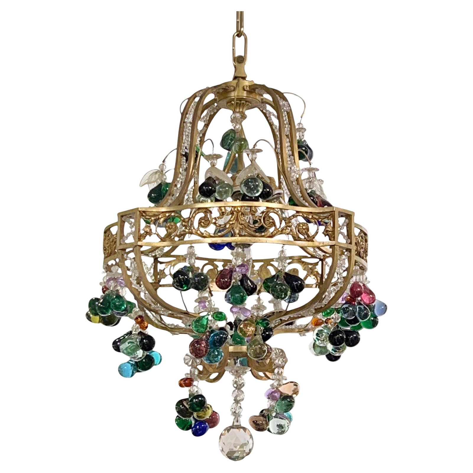 Neoclassical Bronze Chandelier with Glass Fruit and Crystal Bead Accents: Neoclassical Bronze Chandelier with Glass Fruit and Crystal Bead Accents This antique neoclassical chandelier, crafted from bronze circa 1900, features intricate chains of crystal beads, flower head d