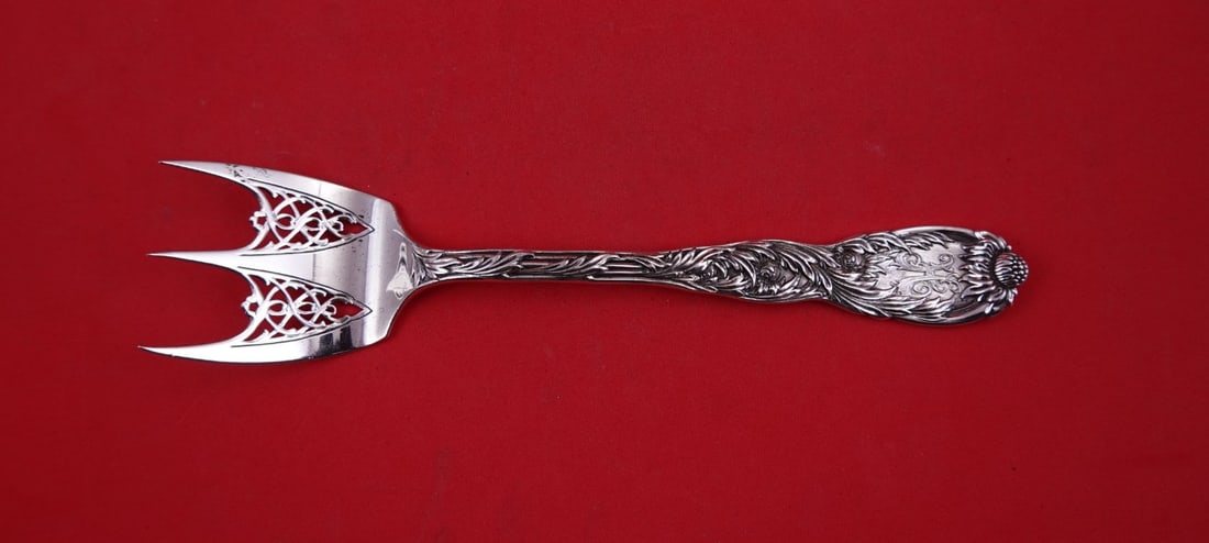 Tiffany & Co Chrysanthemum Sterling Silver 3 Tine Toast Fork 8 3/4: Tiffany & Co Chrysanthemum Sterling Silver 3 Tine Toast Fork 8 3/4 A Tiffany & Co. Chrysanthemum sterling silver toast fork with a pierced 3-tine design. It measures 8 3/4 inches and features an Art N