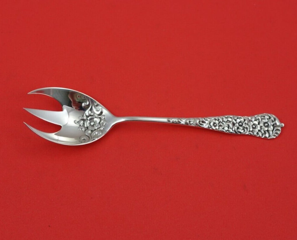 Dominick & Haff Rococo Sterling Silver Ice Cream Fork Floral Design: Dominick & Haff Rococo Sterling Silver Ice Cream Fork Floral Design Indulge in a touch of elegance with this Rococo pattern ice cream fork by Dominick & Haff. Crafted from high-quality sterling silver