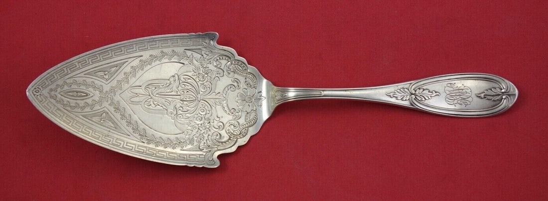 Farrington & Hunnewell Olive Pattern Sterling Silver Pie Server 9 inch with Dolphins: Farrington & Hunnewell Olive Pattern Sterling Silver Pie Server 9 inch with Dolphins This exquisite pie server from the Olive pattern by Farrington & Hunnewell showcases a classic design with a flat h