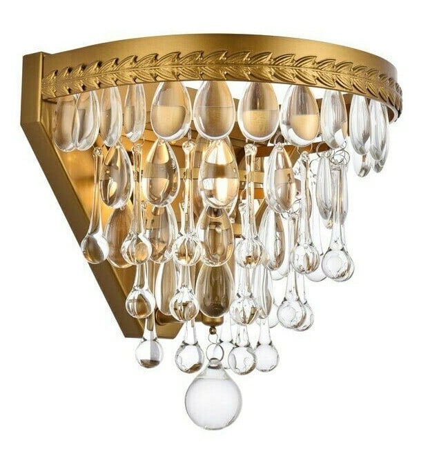 Living District Nordic 9 inch wall sconce brass clear glass: Living District Nordic 9 inch wall sconce brass clear glass Modern wall sconce with a brass and clear finish, featuring clear glass crystals and a Royal Cut Clear crystal detail. It is a 1-light indoo