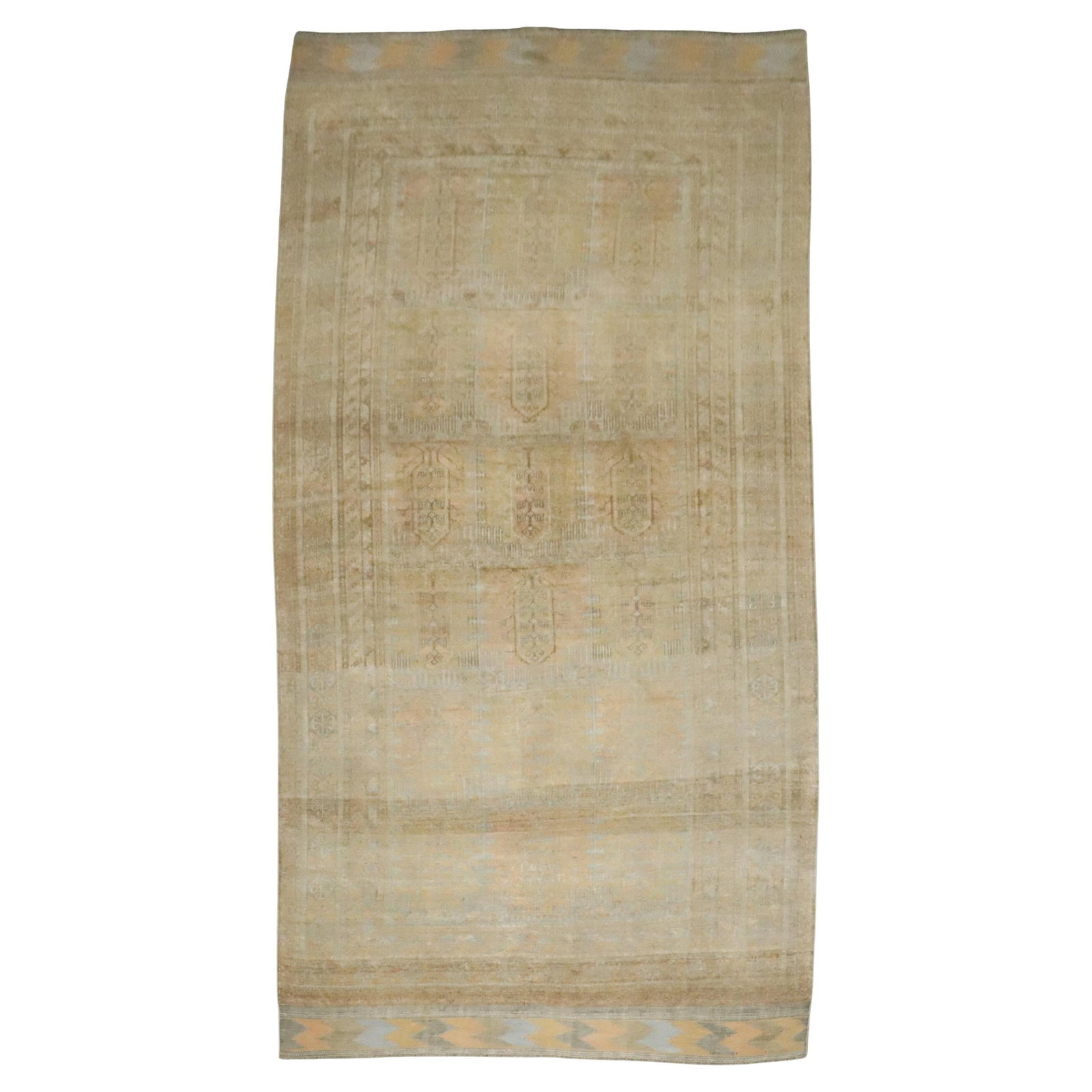 Early 20th Century Tribal Wool Persian Balouch Rug 7'2" x 13'6": Early 20th Century Tribal Wool Persian Balouch Rug 7'2" x 13'6" This early 20th-century Persian Balouch carpet features a tribal geometric design and is hand-knotted from wool. Originating from Iran a