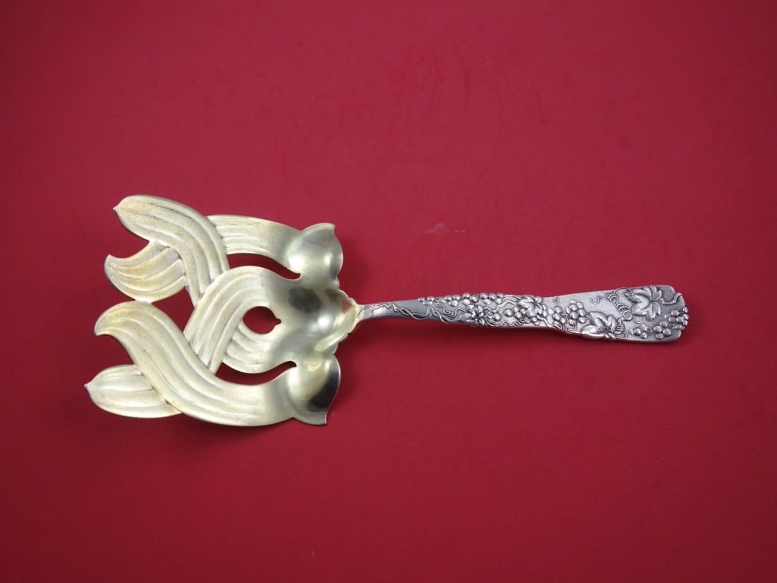 Tiffany & Co. Vine Sterling Silver Asparagus Fork with Gold-Washed Cross 9.75": Tiffany & Co. Vine Sterling Silver Asparagus Fork with Gold-Washed Cross 9.75" This exquisite Sterling Silver Asparagus Serving Fork, part of the Vine pattern by Tiffany & Co., embodies the elegance o