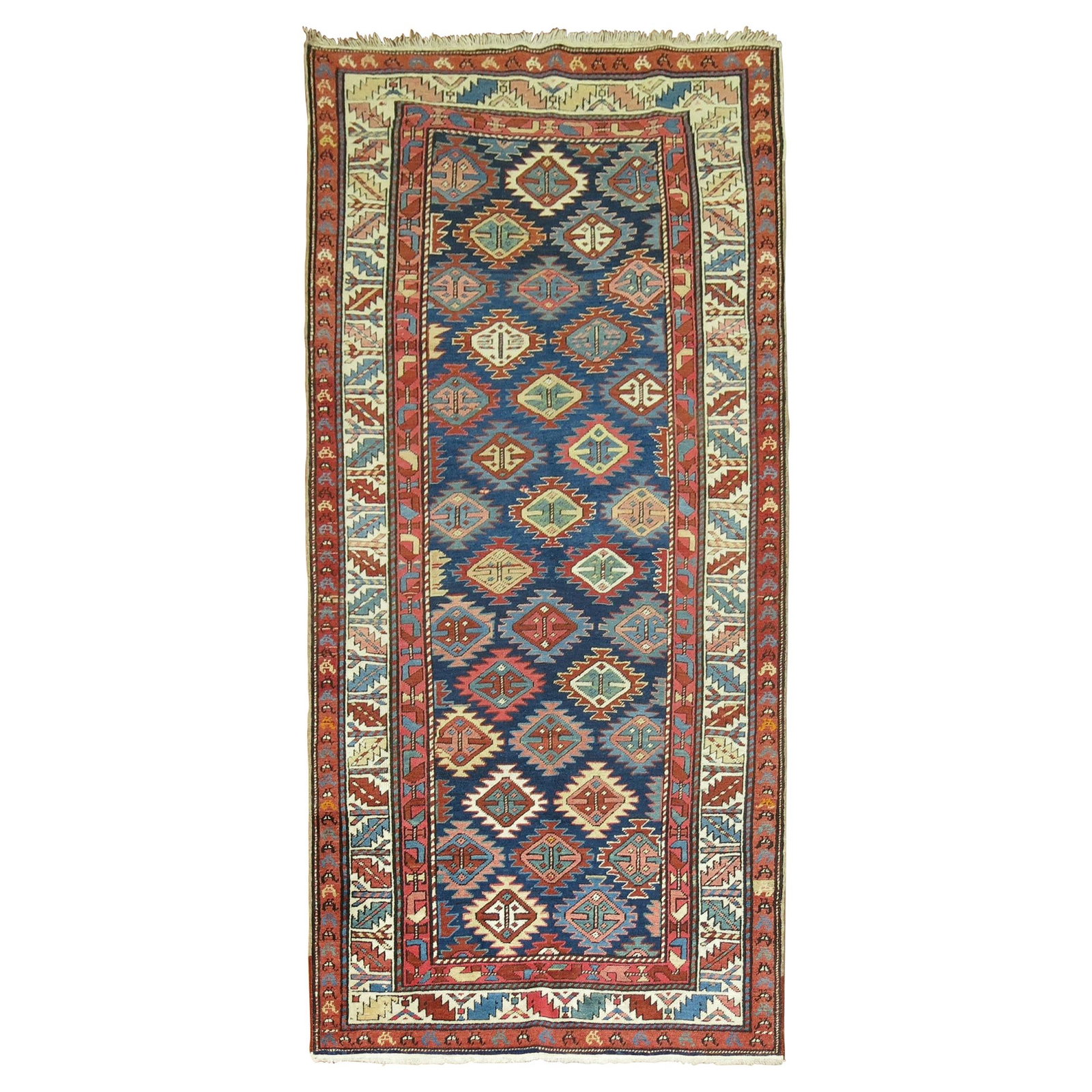 Early 20th Century Shirvan Wool Runner with Geometric Tribal Motifs: Early 20th Century Shirvan Wool Runner with Geometric Tribal Motifs This antique Shirvan short runner from the early 20th century features a colorful geometric design on a navy blue field, characteris