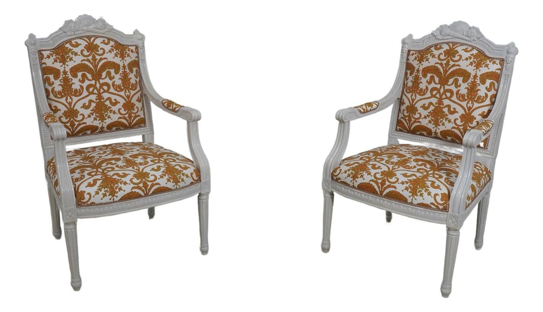 Exquisite Pair of 1930s Louis XVI Open Arm Chairs White Finish: Exquisite Pair of 1930s Louis XVI Open Arm Chairs White Finish This exquisite pair of Louis XVI open arm chairs showcases a timeless design from the 1930s, featuring fine ornate carved details and hig