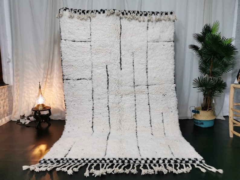 Authentic White Handmade Moroccan Berber Rug 8 x 5 Feet: Authentic White Handmade Moroccan Berber Rug 8 x 5 Feet Experience the warmth and beauty of this Authentic White Soft Handmade Moroccan Berber Rug. Crafted with care by local Berber women weavers in t