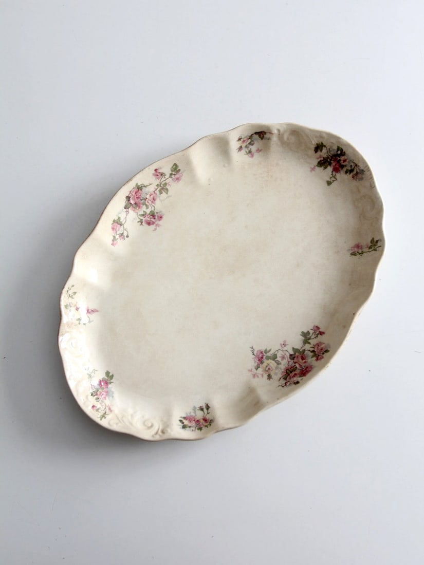 Lamberton Maddock Oval Floral Porcelain Serving Platter: Lamberton Maddock Oval Floral Porcelain Serving Platter This antique Lamberton Maddock porcelain platter features scattered pink floral motifs on a warm ivory background, highlighted by a softly scall