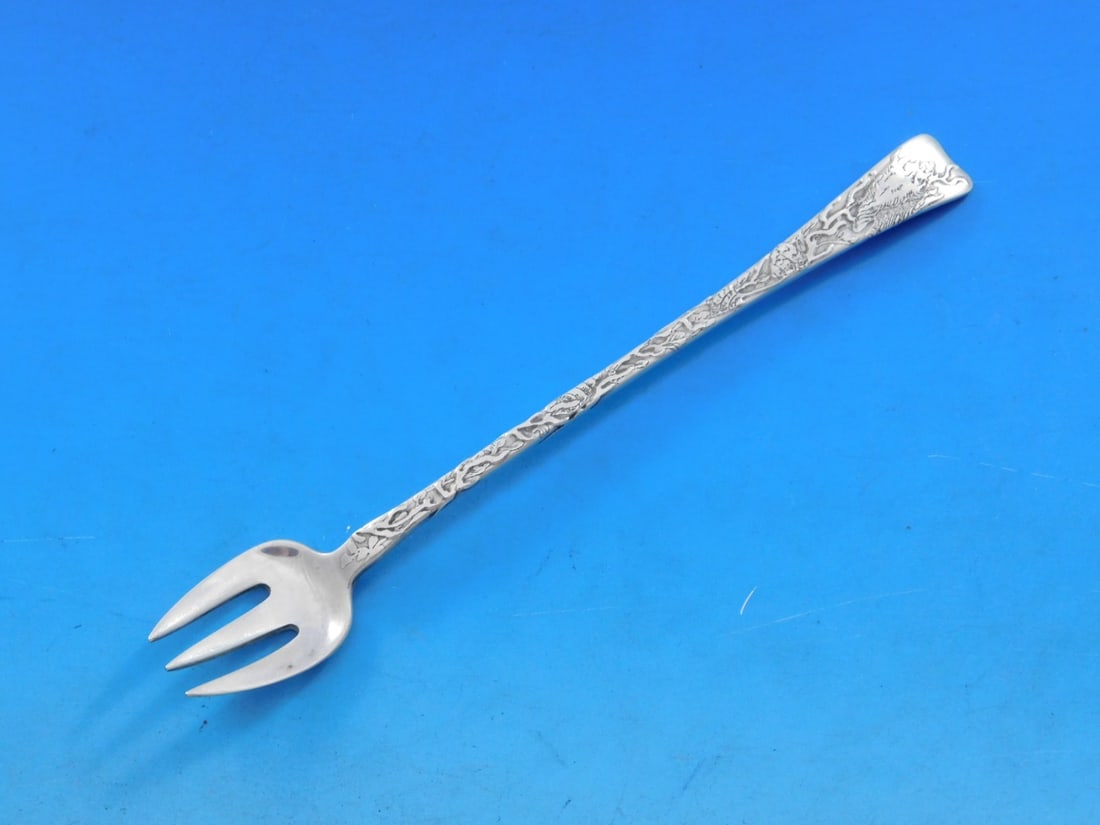 Tiffany Sterling Silver 6" Lap Over Acid Etched Cocktail Fork: Tiffany Sterling Silver 6" Lap Over Acid Etched Cocktail Fork This exquisite cocktail fork by Tiffany & Co. features the elegant Lap Over Edge pattern and is crafted from high-quality sterling silver.