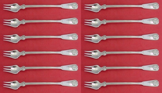 Tiffany & Co Shell & Thread Sterling Silver Cocktail Fork Set 12 pcs 6 inch: Tiffany & Co Shell & Thread Sterling Silver Cocktail Fork Set 12 pcs 6 inch Elevate your dining experience with this exquisite 12-piece cocktail fork set from Tiffany & Co., featuring the renowned
