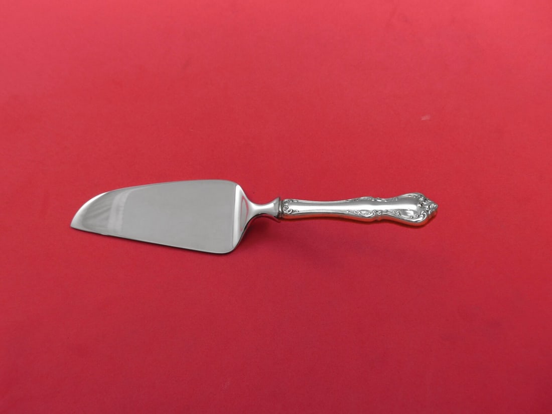 Towle Debussy Sterling Silver Cheese Server 7 1/8 Custom Made: Towle Debussy Sterling Silver Cheese Server 7 1/8 Custom Made This elegant cheese server is crafted from sterling silver with a hollow handle and features a stainless steel blade with a straight edge.