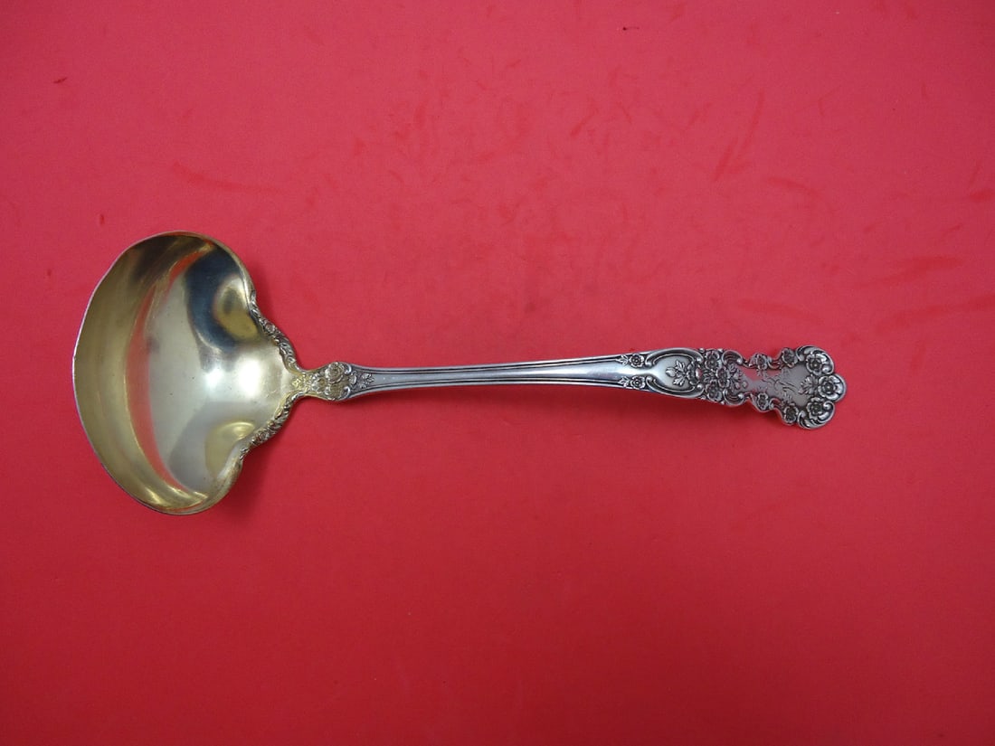 Gorham Buttercup Sterling Silver Soup Ladle Gold Washed 10 1/4": Gorham Buttercup Sterling Silver Soup Ladle Gold Washed 10 1/4" Experience the elegance of the Buttercup pattern by Gorham with this exquisite sterling silver soup ladle. Crafted between 1850 and 1899