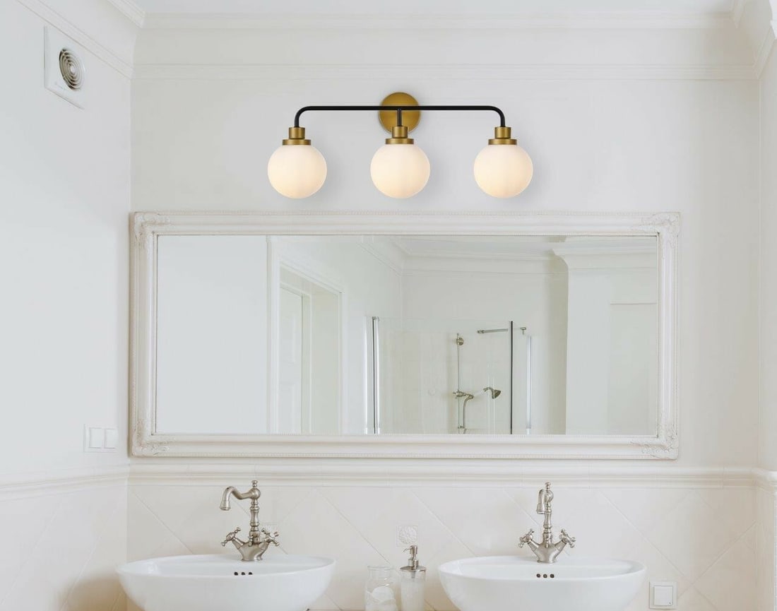 Hanson 3 Light Wall Sconce Black Brass Frosted Glass 27.6 in: Hanson 3 Light Wall Sconce Black Brass Frosted Glass 27.6 in Modern 3-light wall sconce in a black and brass finish with frosted glass shades. It is hardwired, ETL dry rated, and dimmable, with an ind
