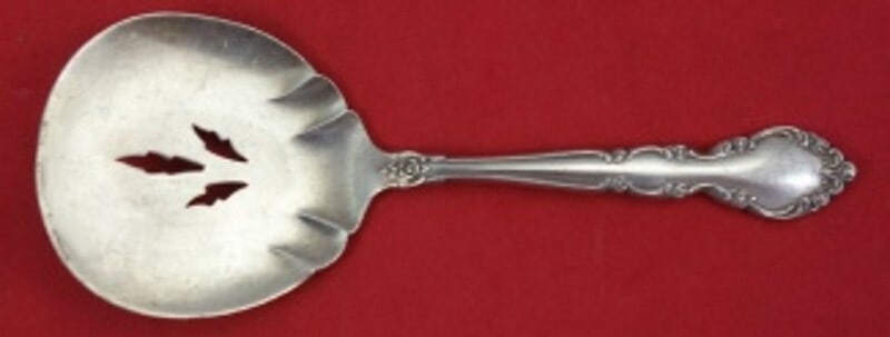 Oneida Grandeur Sterling Silver Nut Spoon 3-Hole Piercing 4 3/4": Oneida Grandeur Sterling Silver Nut Spoon 3-Hole Piercing 4 3/4" This exquisite nut spoon from Oneida's Grandeur pattern showcases a beautifully crafted sterling silver design, featuring a practical 3