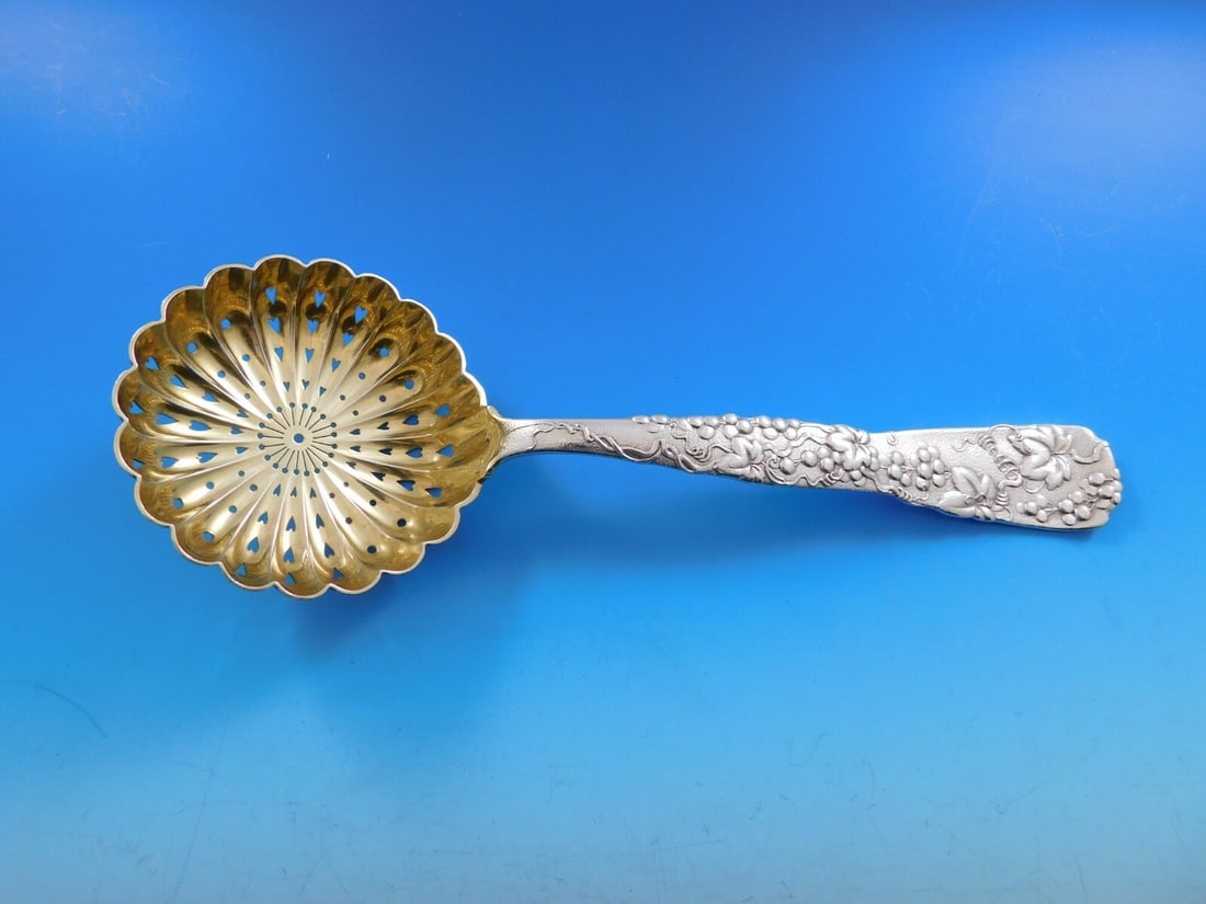 Tiffany Co Vine Sterling Silver Slotted Pea Spoon Gold Washed Bowl 8 3/4: Tiffany Co Vine Sterling Silver Slotted Pea Spoon Gold Washed Bowl 8 3/4 A Vine pattern pea spoon by Tiffany & Co., made of sterling silver with a gold washed bowl. The spoon features a pierced design