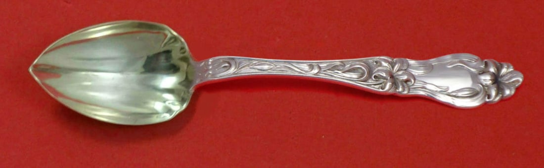 Frank Whiting Lily Sterling Silver Fluted Grapefruit Spoon 5 3/4": Frank Whiting Lily Sterling Silver Fluted Grapefruit Spoon 5 3/4" This exquisite grapefruit spoon is part of the 'Lily' pattern by Frank Whiting, meticulously crafted from high-quality sterling silver