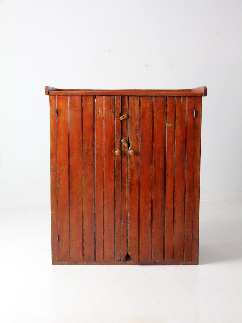 Rustic Antique Primitive Cabinet with 5 Shelves and Bead-Board Design: Rustic Antique Primitive Cabinet with 5 Shelves and Bead-Board Design This antique primitive cabinet showcases a rustic farmhouse style with its bead-board construction and solid blocky wood lock clos