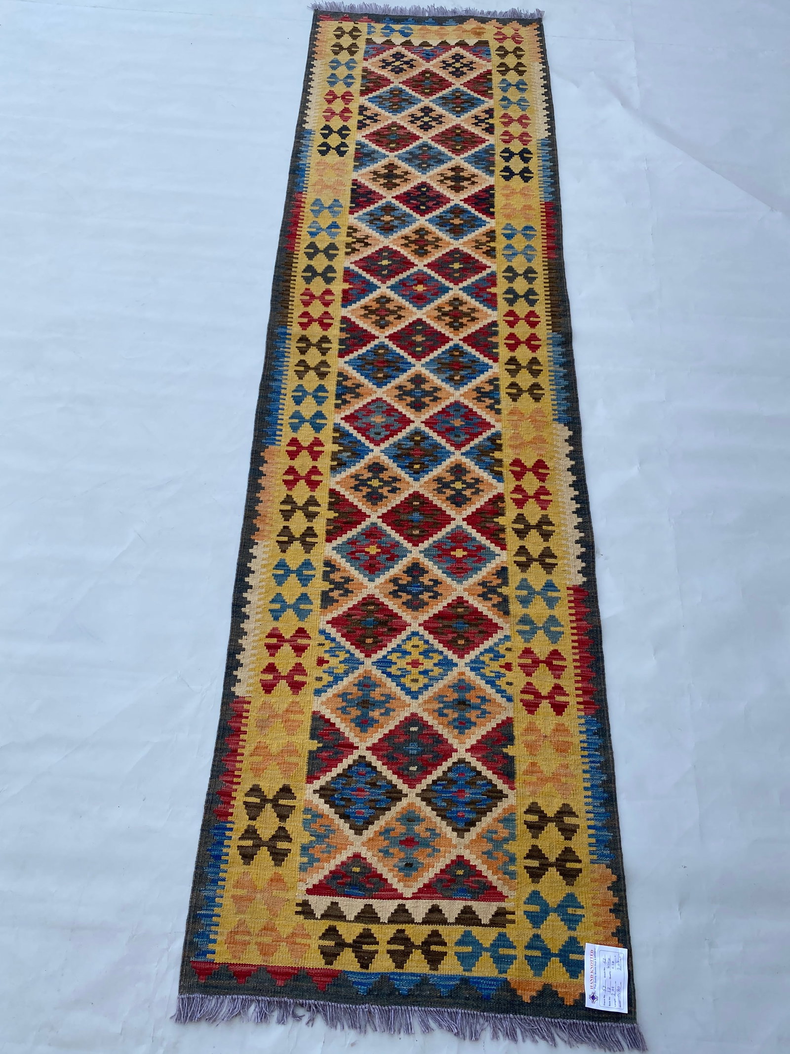 Vibrant 3' x 10' Multi-Color Yellow Kilim Rug Handmade Tribal Runner: Vibrant 3' x 10' Multi-Color Yellow Kilim Rug Handmade Tribal Runner Free continental US Shipping Introducing the vibrant 3' x 10' Multi-Color Yellow Kilim Rug, a stunning flatweave runner that enhanc