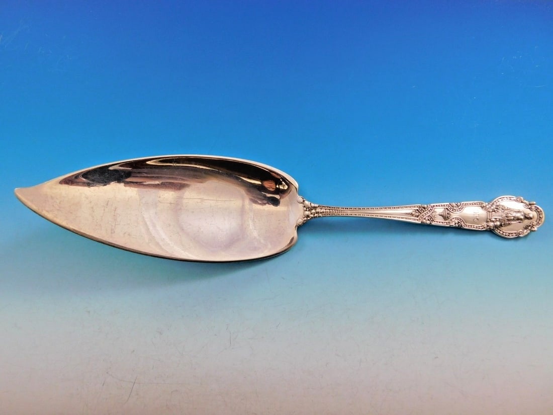 Tiffany and Co Renaissance Sterling Silver Fish Server 11 1/2 in: Tiffany and Co Renaissance Sterling Silver Fish Server 11 1/2 in A Renaissance pattern sterling silver fish server by Tiffany & Co., measuring 11 1/2 inches. This figural serving piece features the or