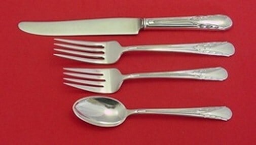 International Silver Orchid 4-Piece Sterling Silver Place Setting: International Silver Orchid 4-Piece Sterling Silver Place Setting Enhance your dining experience with this exquisite 4-piece place setting from the Orchid pattern by International Sterling. Crafted fr